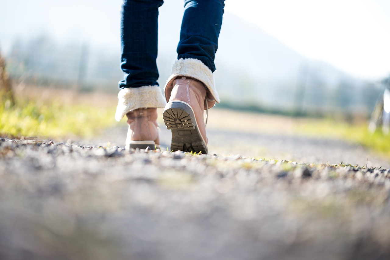 woman-walking-along-a-rural-path-2023-11-27-05-20-08-utc.jpg
