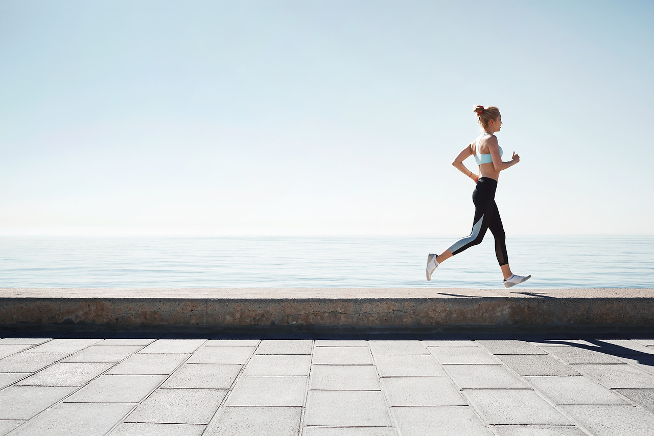 jogging-young-woman-running-shore.jpg