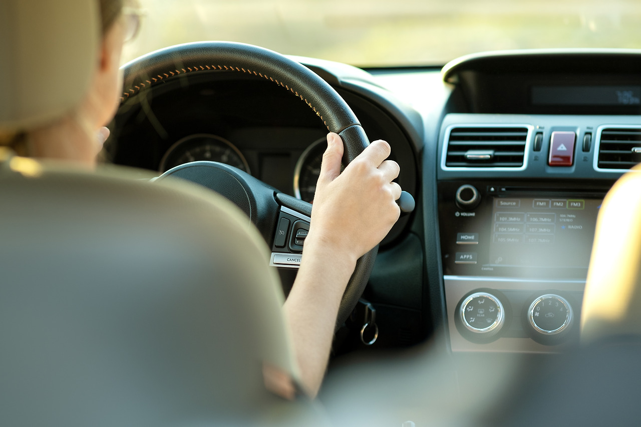 close-up-view-of-woman-holding-steering-wheel-driv-2023-11-27-04-53-34-utc.jpg