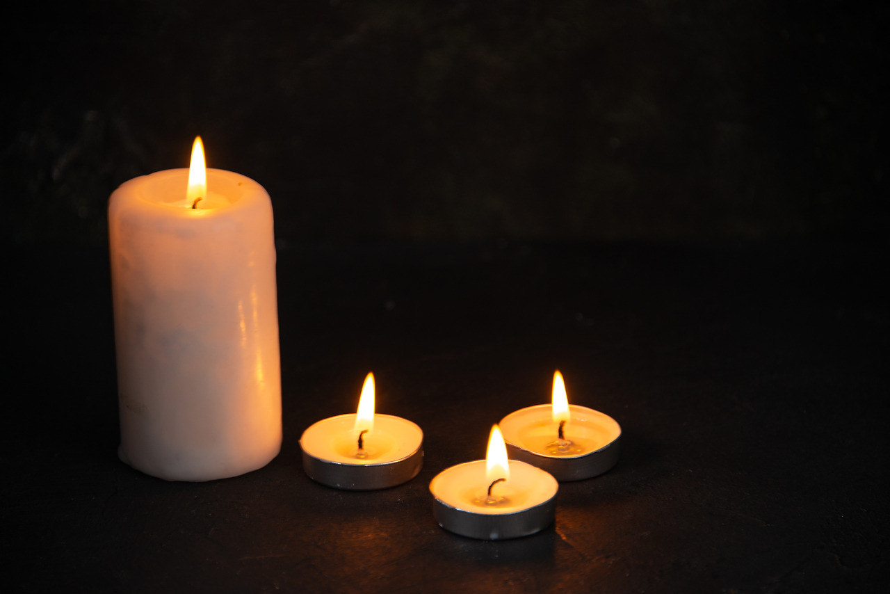 front-view-of-burning-candles-on-dark-floor-evil-f-2023-04-25-22-51-31-utc.jpg