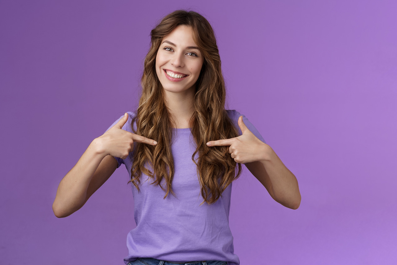cheerful-motivated-professional-assertive-curly-woman-pointing-herself-center-smiling-broadly-propose-own-help-wanna-participate-boastful-talking-accomplishments-stand-purple-background.jpg