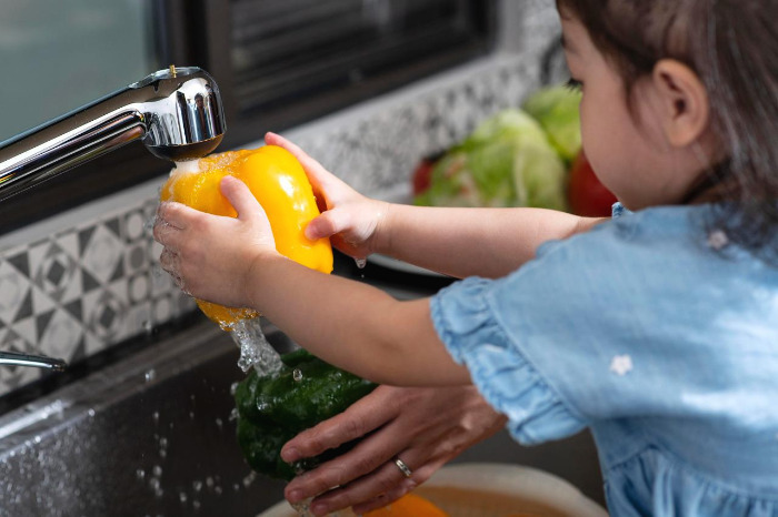 close-up-girl-washing-vegetable.jpg