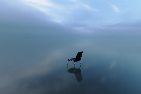single-chair-reflecting-water-surface-stormy-day.jpg