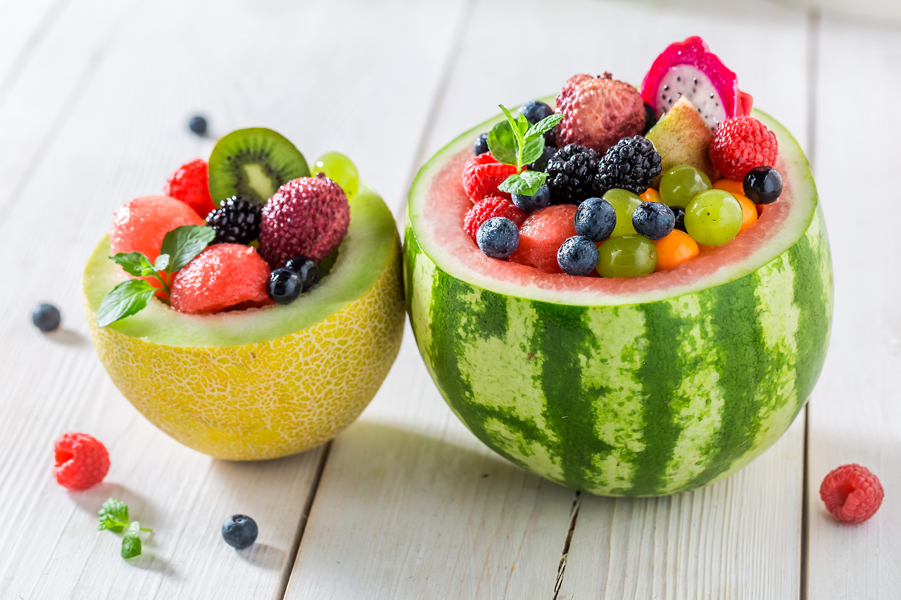 tropical-fruits-salad-in-watermelon-and-melon-on-w-2023-11-27-05-27-29-utc.jpg