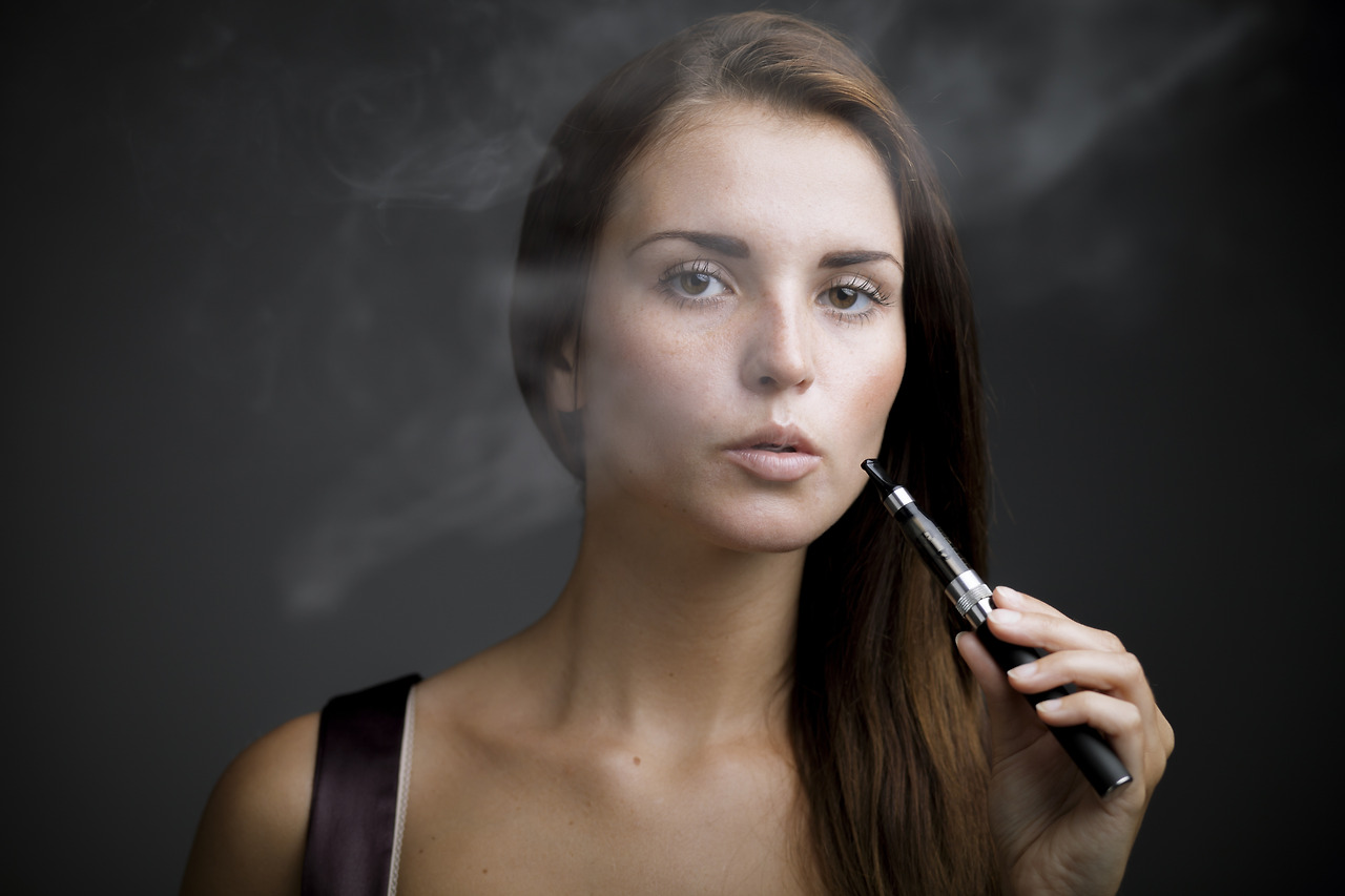 elegant-woman-smoking-e-cigarette-with-smoke-2024-10-31-00-50-50-utc.jpg