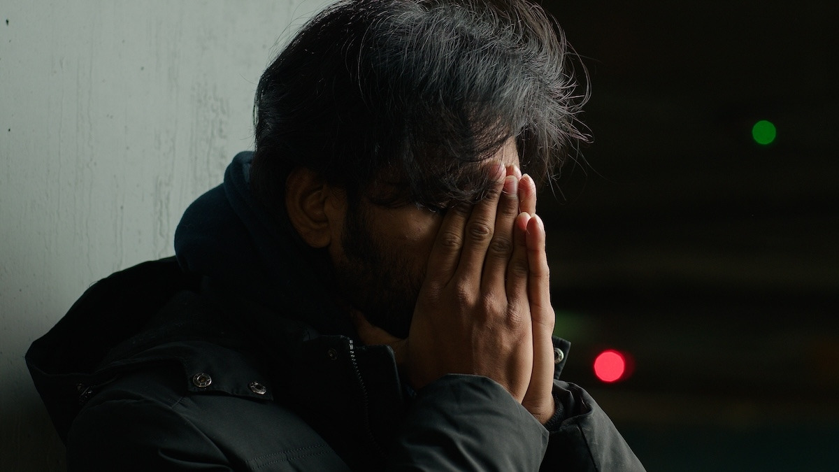 Homeless man in dark city.jpg