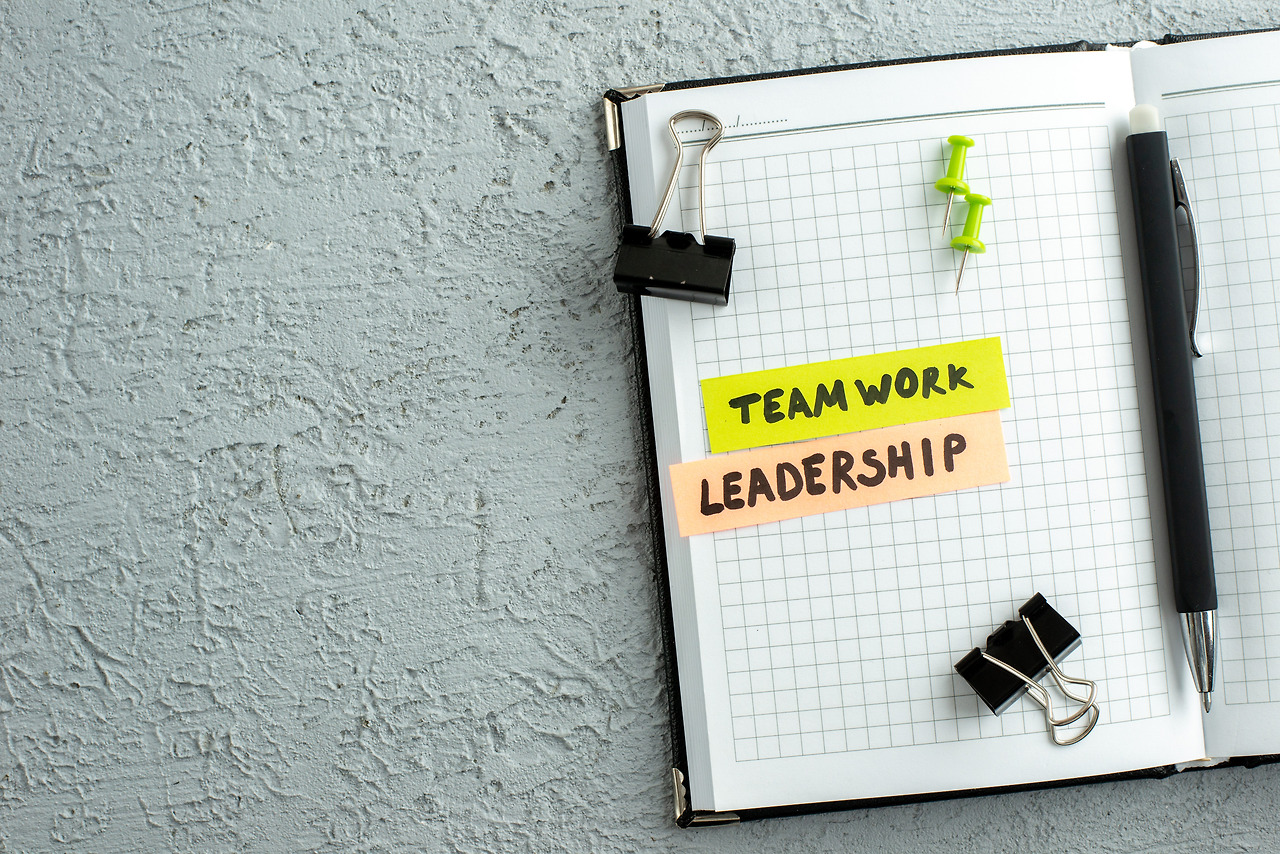 top-view-of-teamwork-leadership-writings-pen-and-o-2023-11-27-05-08-23-utc.jpg