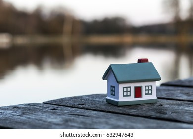 small-model-house-on-background-260nw-632947643.jpg