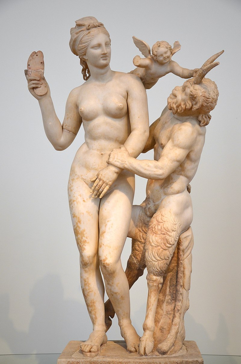 Group_of_Aphrodite,_Pan_and_Eros,_found_in_the_House_of_the_Poseidoniastai_of_Beryttos_on_Delos,_Aphrodite_attempts_to_fend_off_Pan_who_makes_erotic_advances,_National_Archaeological_Museum_of_Athens_(13912357968).jpg