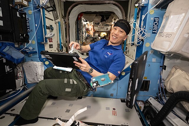 NASA_astronaut_Jonny_Kim_performs_laptop_computer_maintenance_(iss073e1044139).jpg