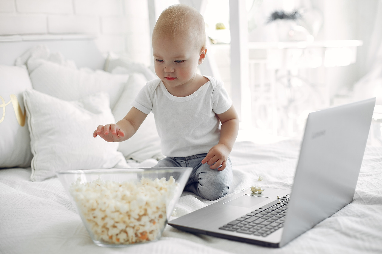 cute-little-boy-playing-with-laptop-bed.jpg