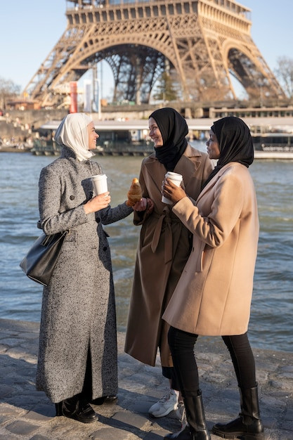 muslim-women-traveling-paris-together_23-2149364096.jpg