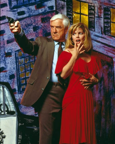 Leslie-Nielsen-&-Priscilla-Presley-in-Naked-Gun-From-the-Files-of-Police-Squad-The-Premium-Photograph-and-Poster-1010050__08107.jpg