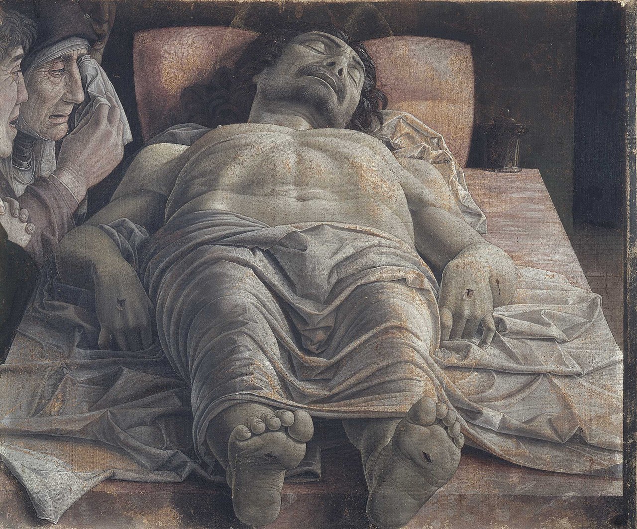1280px-The_dead_Christ_and_three_mourners%2C_by_Andrea_Mantegna.jpg