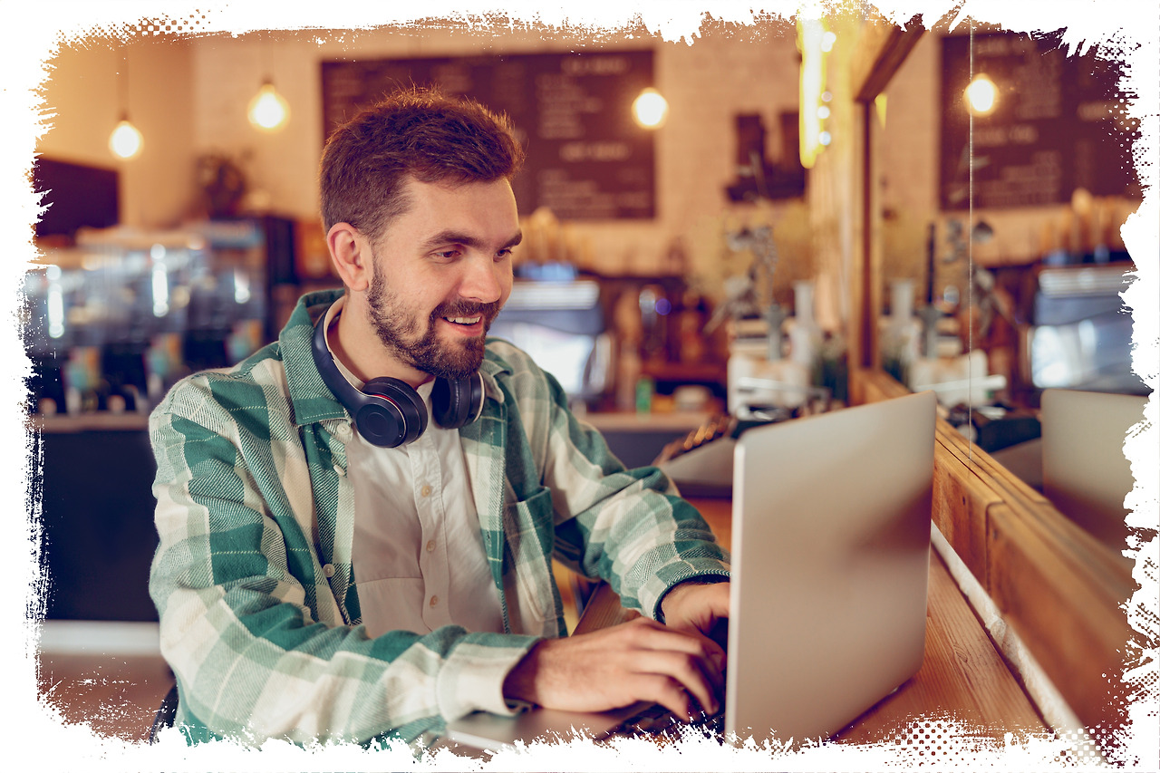 batch_cheerful-bearded-man-working-on-laptop-in-cafeteri-2022-02-23-02-57-27-utc.jpg