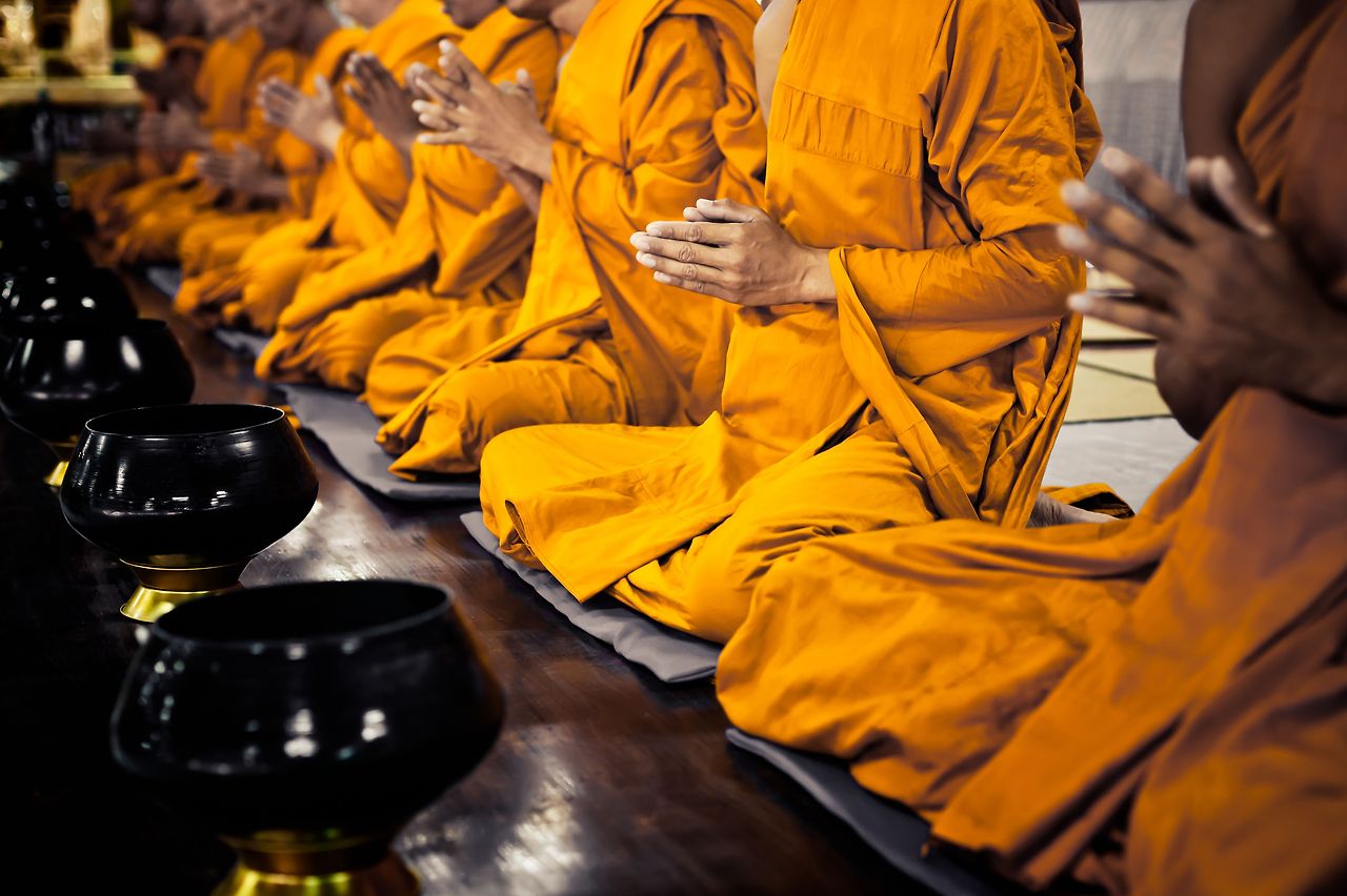 buddhist-monks-praying-185091185-5b7a36d446e0fb0050bc4ea0.jpg