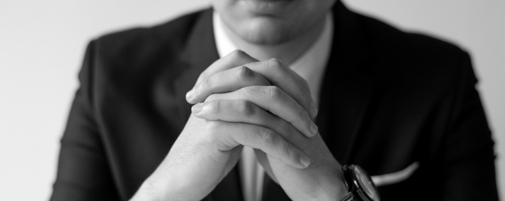 closeup-business-man-with-clasped-hands.jpg