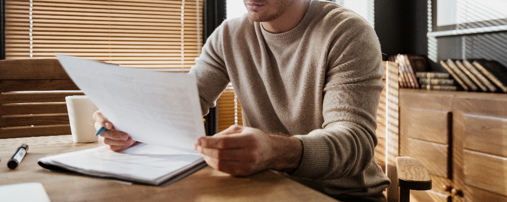 attractive-young-man-office-working-with-documents.jpg