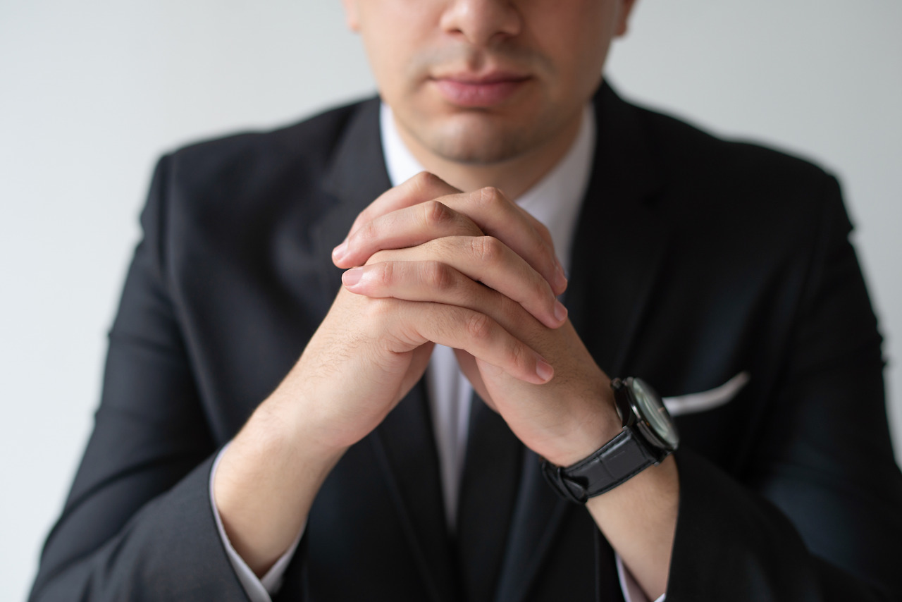 closeup-business-man-with-clasped-hands.jpg