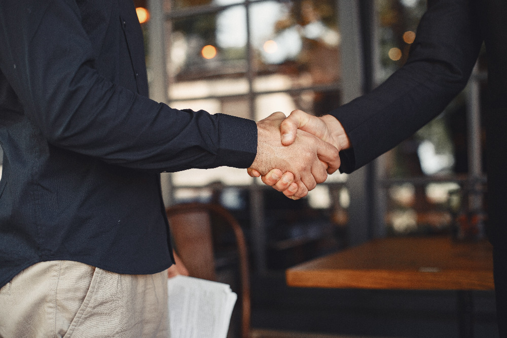 men-shake-hands-enclosure-business-agreement-understanding-business-partners.jpg