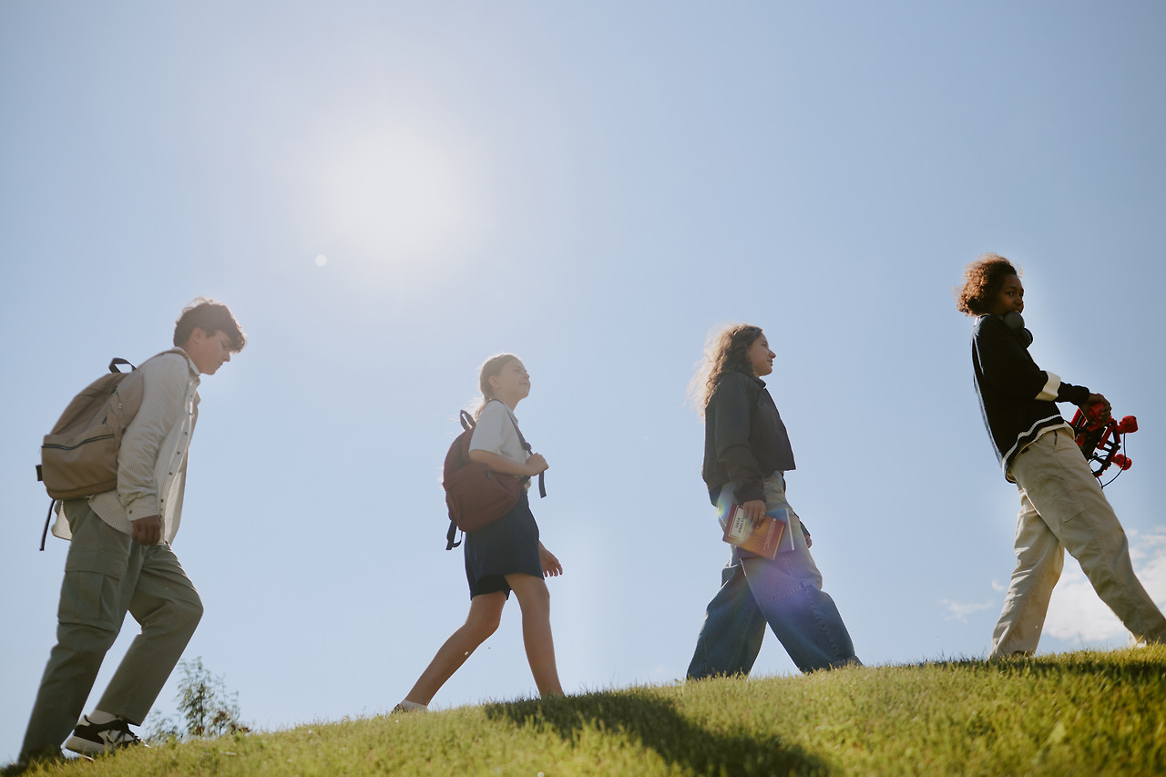 teens-walking-on-grass-2025-02-11-13-32-36-utc.jpg