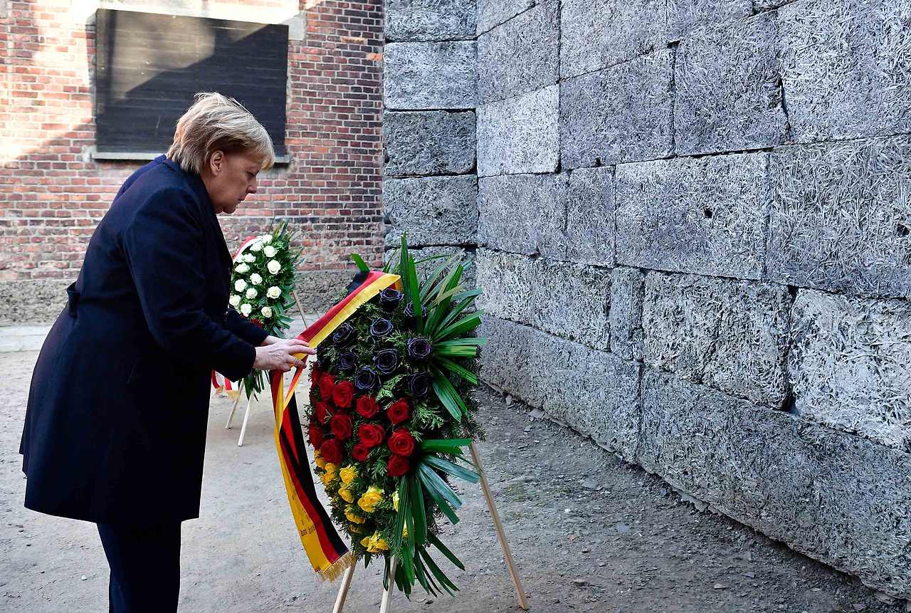 191206112729-06-auschwitz-merkel-1206.jpg