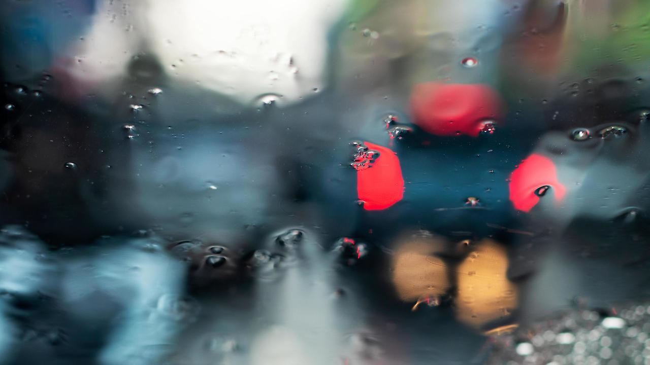 abstract-background-blur-from-a-car-windshield-in-looking-through-many-rain-drops-to-the-red-light-at-the-end-of-the-car-which-was-parked-on-the-street-at-night-free-photo.jpg