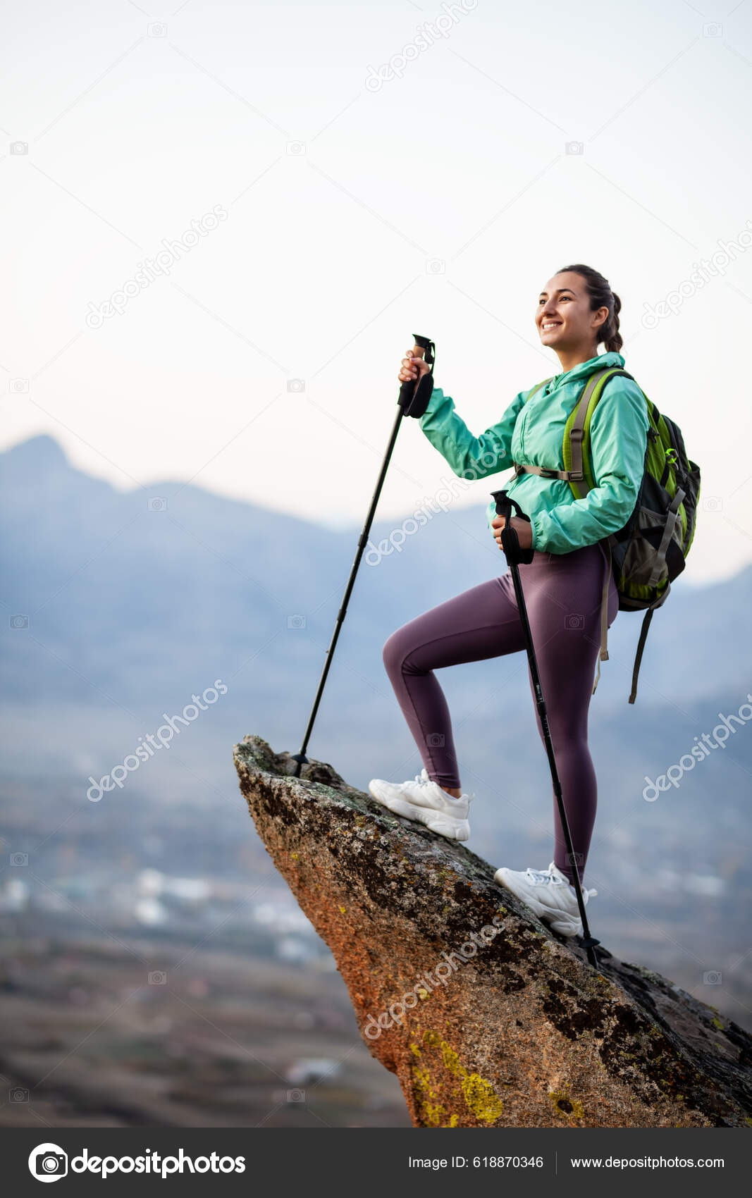 depositphotos_618870346-stock-photo-hiker-girl-resting-rock-pedestal.jpg