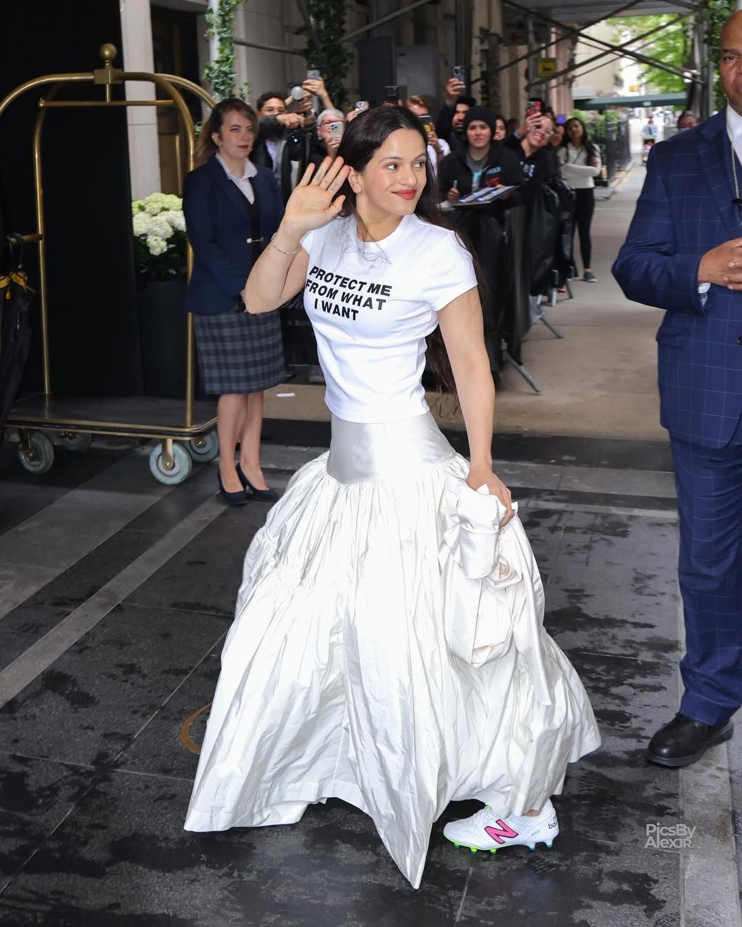 Rosalía makes a statement wearing a ‘Protect me from what I want” shirt while heading to a pre-Met Gala fitting in NYC  . #rosalia (1).jpg