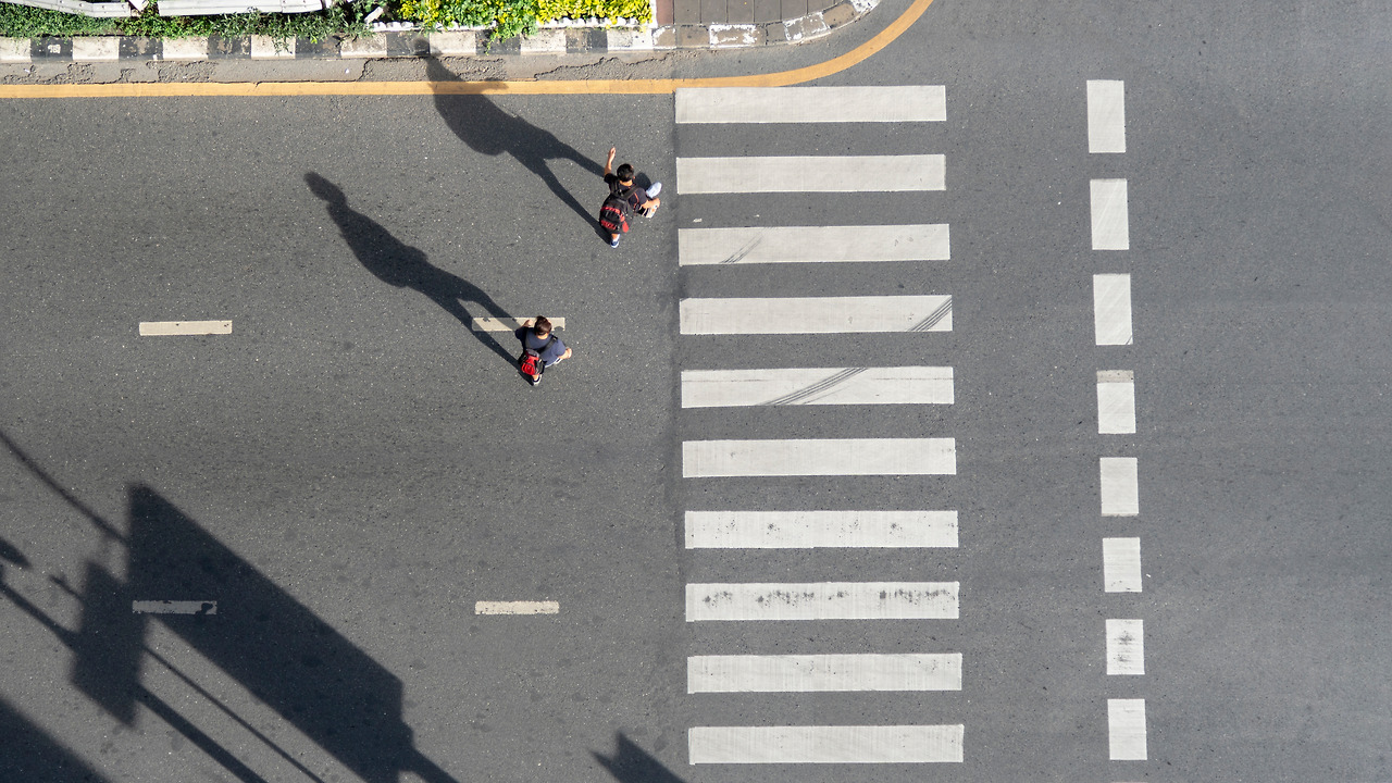 motorcycles-pass-across-pedestrian-crosswalk-road-city.jpg