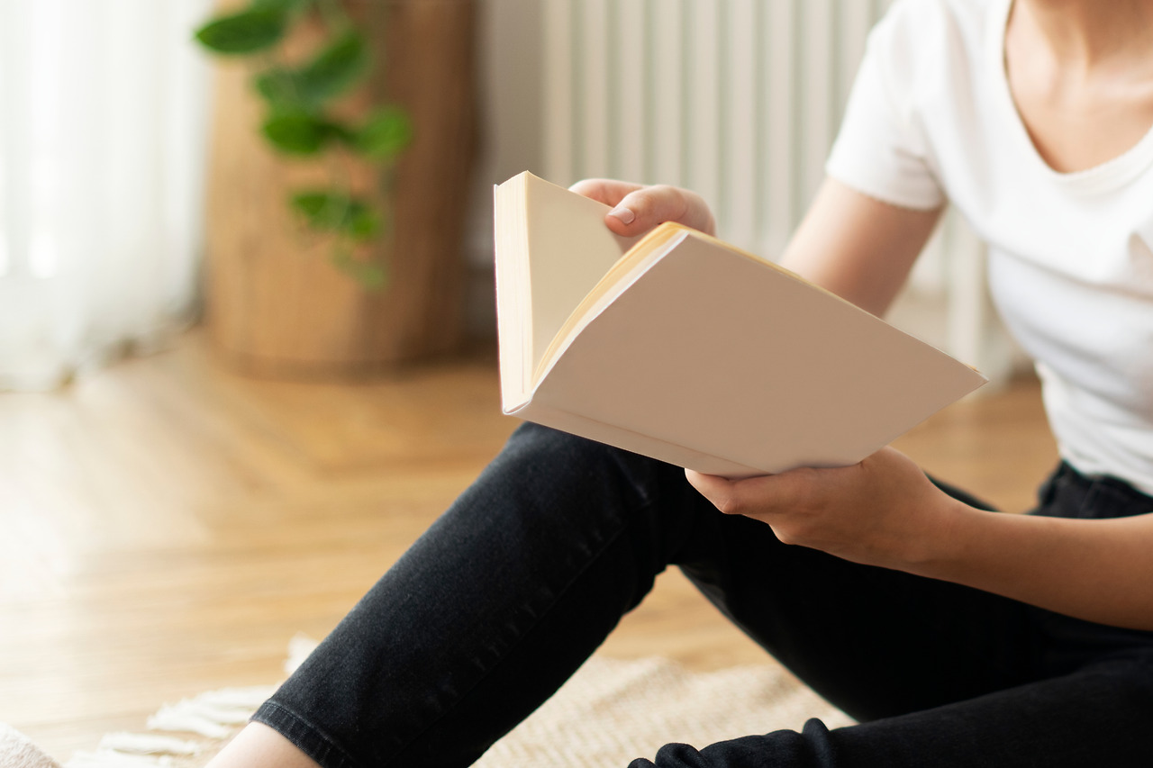 woman-reading-book-sitting-floor.jpg