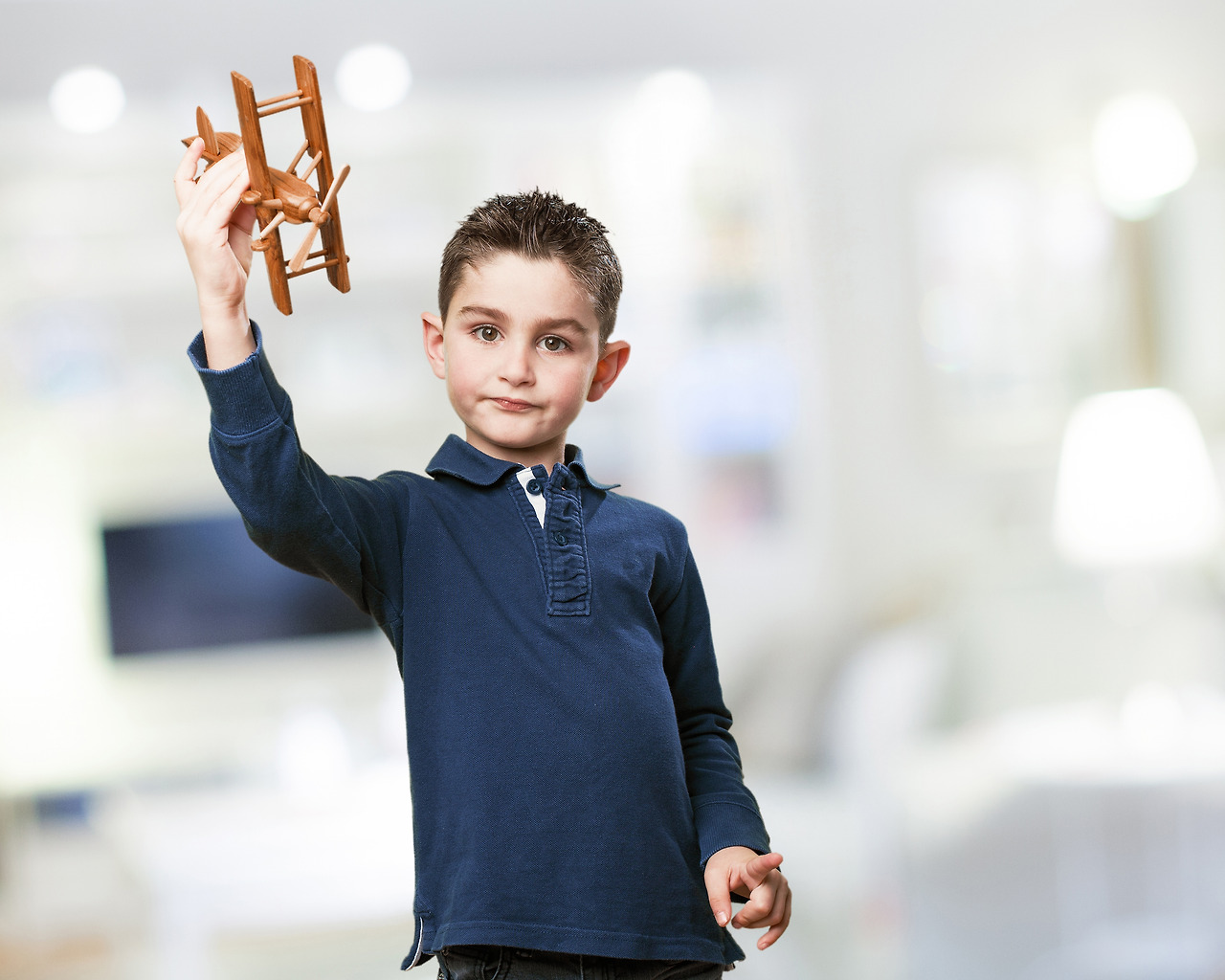 child-with-wooden-plane.jpg