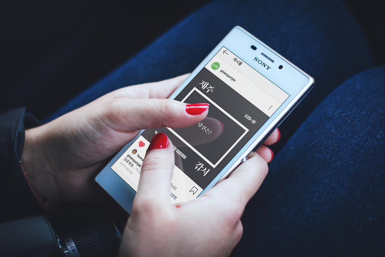 Woman holding Sony Xperia.jpg