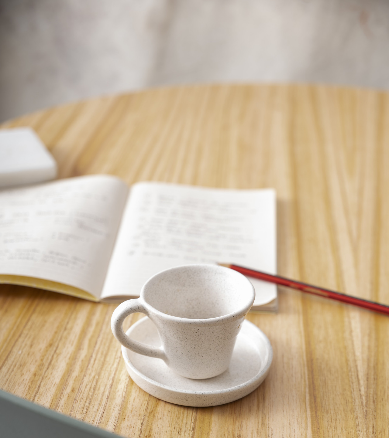 high-angle-coffee-cup-notebook-arrangement.jpg