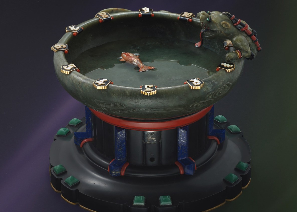 8 Cartier, A unique, historically important and exquisite marble, silver, lapis lazuli, nephrite, coral, mother-of-pearl, enamel and jade “water clock” wi.jpg
