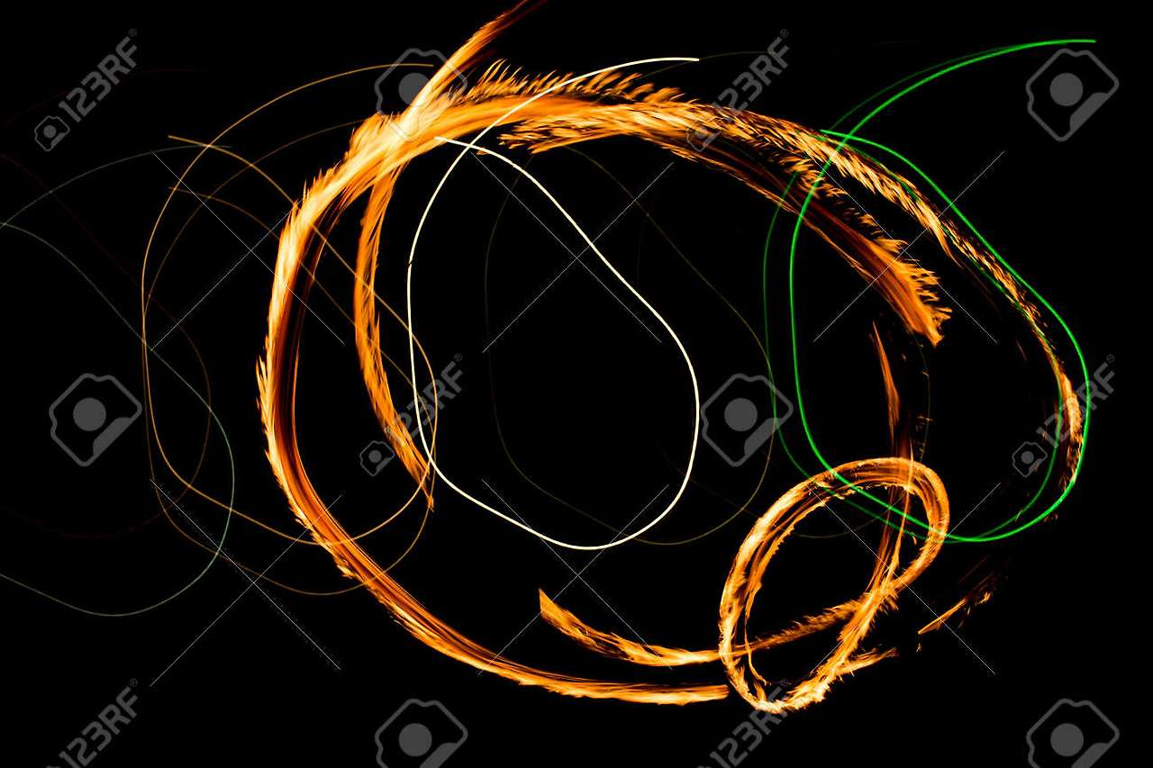180869464-fire-show-fiery-motion-night-performance-abstract-drawing.jpg
