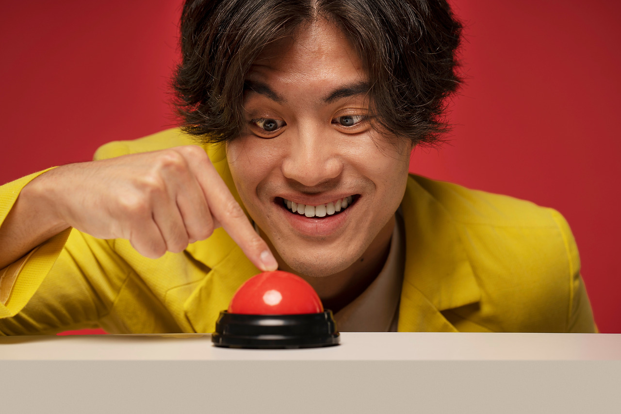 front-view-smiley-man-pressing-buzzer.jpg
