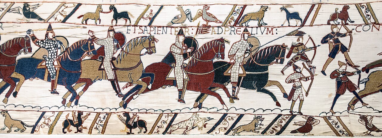 1280px-Bayeux_Tapestry_scene51_Battle_of_Hastings_Norman_knights_and_archers.jpg