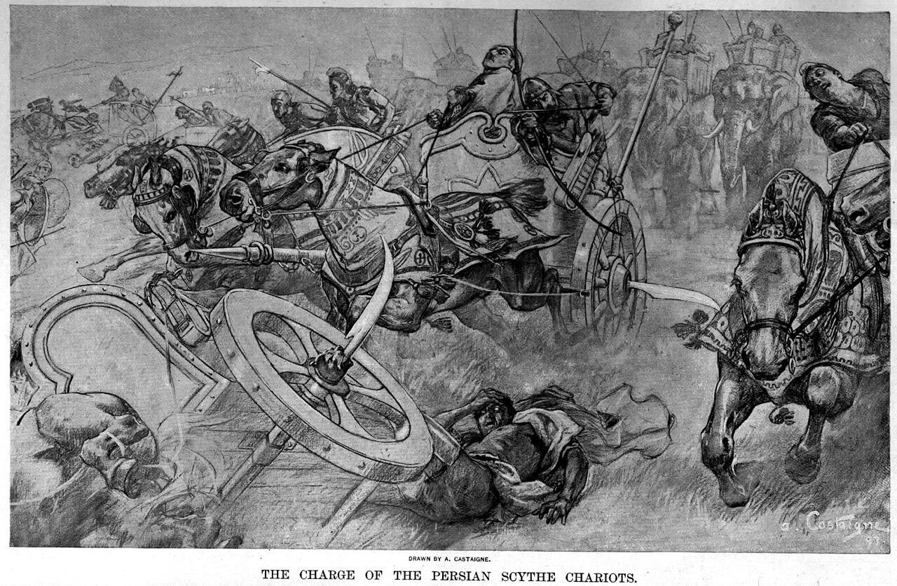 1280px-The_charge_of_the_Persian_scythed_chariots_at_the_battle_of_Gaugamela_by_Andre_Castaigne_(1898-1899).jpg