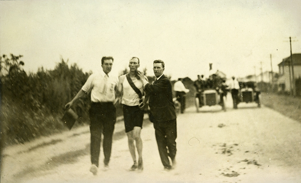 T.J._Hicks_of_Cambridge,_Massachusetts._Winner_of_Marathon_Foot-Race_being_sponged_by_attendants._1904_Olympics.jpg