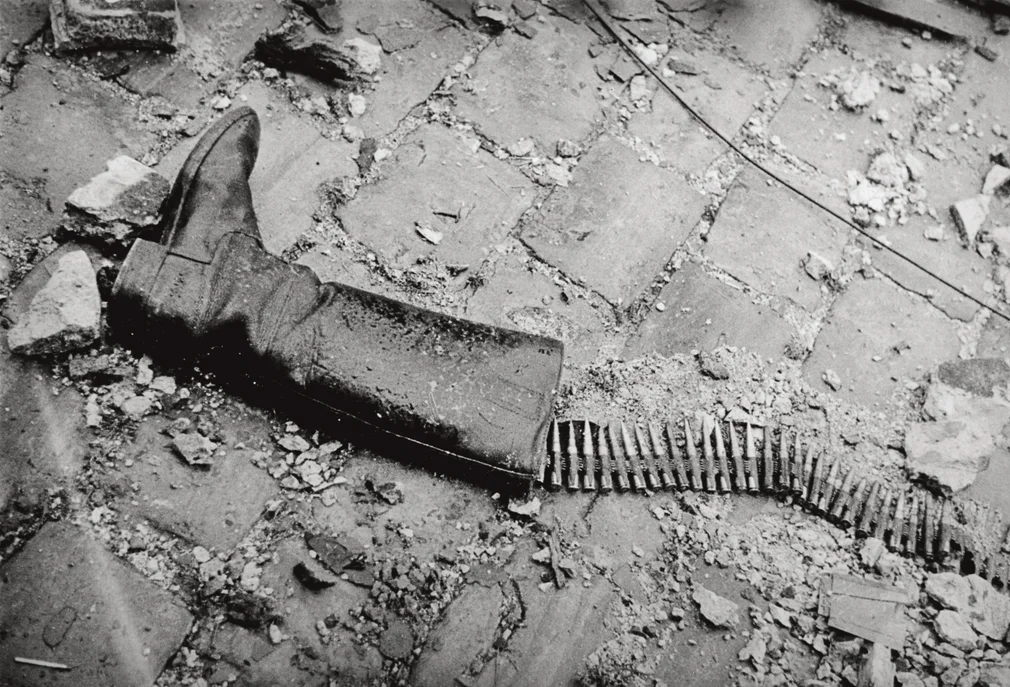 Lee Miller_Boot and ammunition, St Malo, France, 1944.png