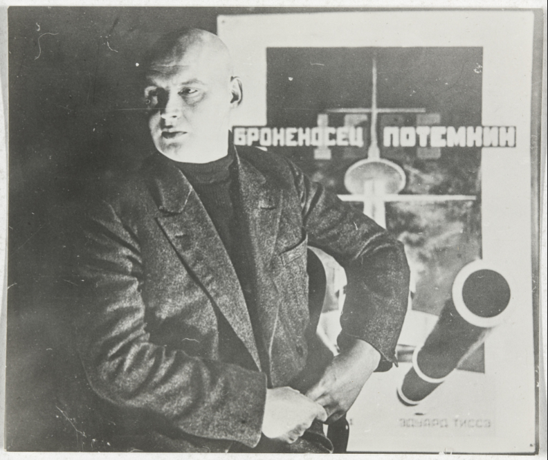 aleksandr rodchenko, untitled, self-portrait with poster for battleship potemkin, c.1925.png