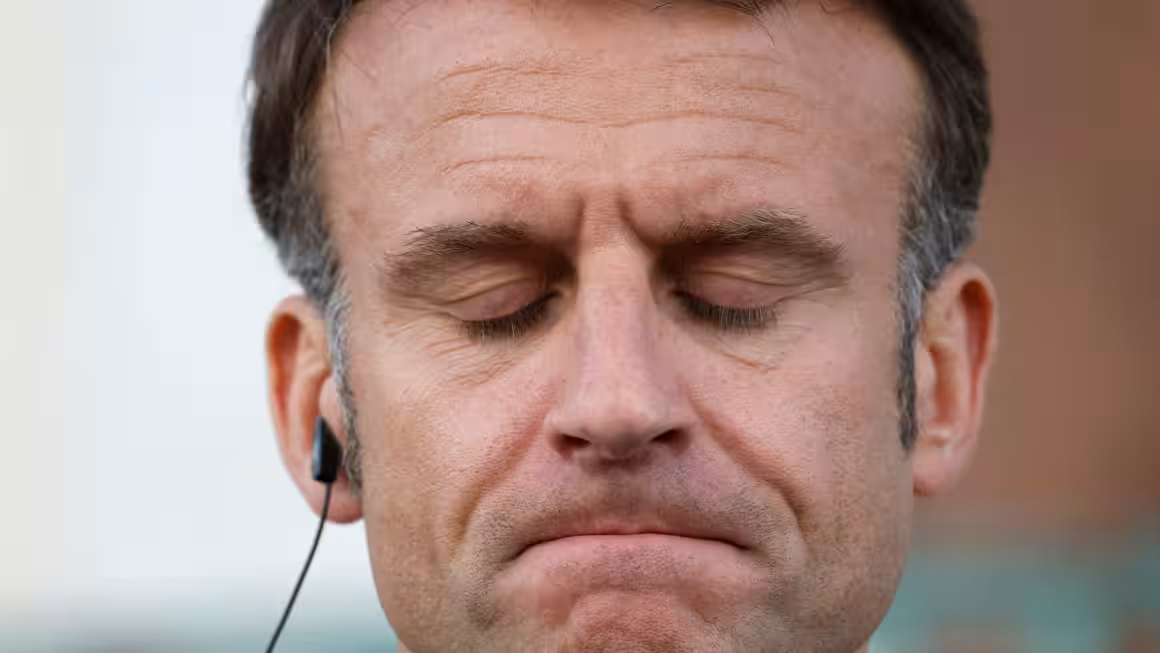 France Macron teeth clinched.png