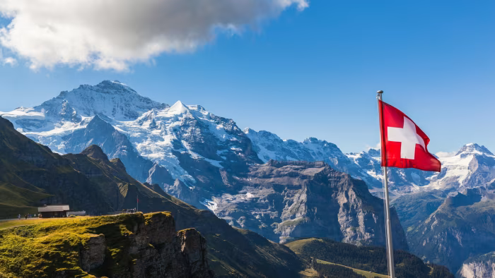 Switzerland flag on mountain.png