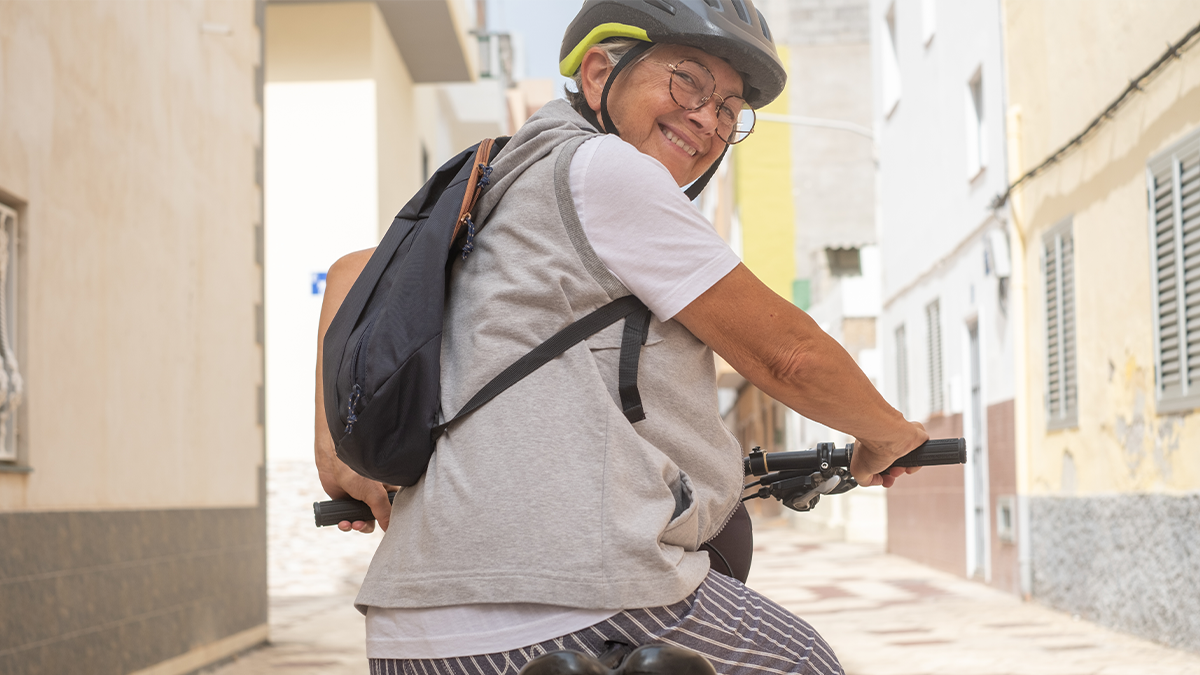old man riding a bicycle.png