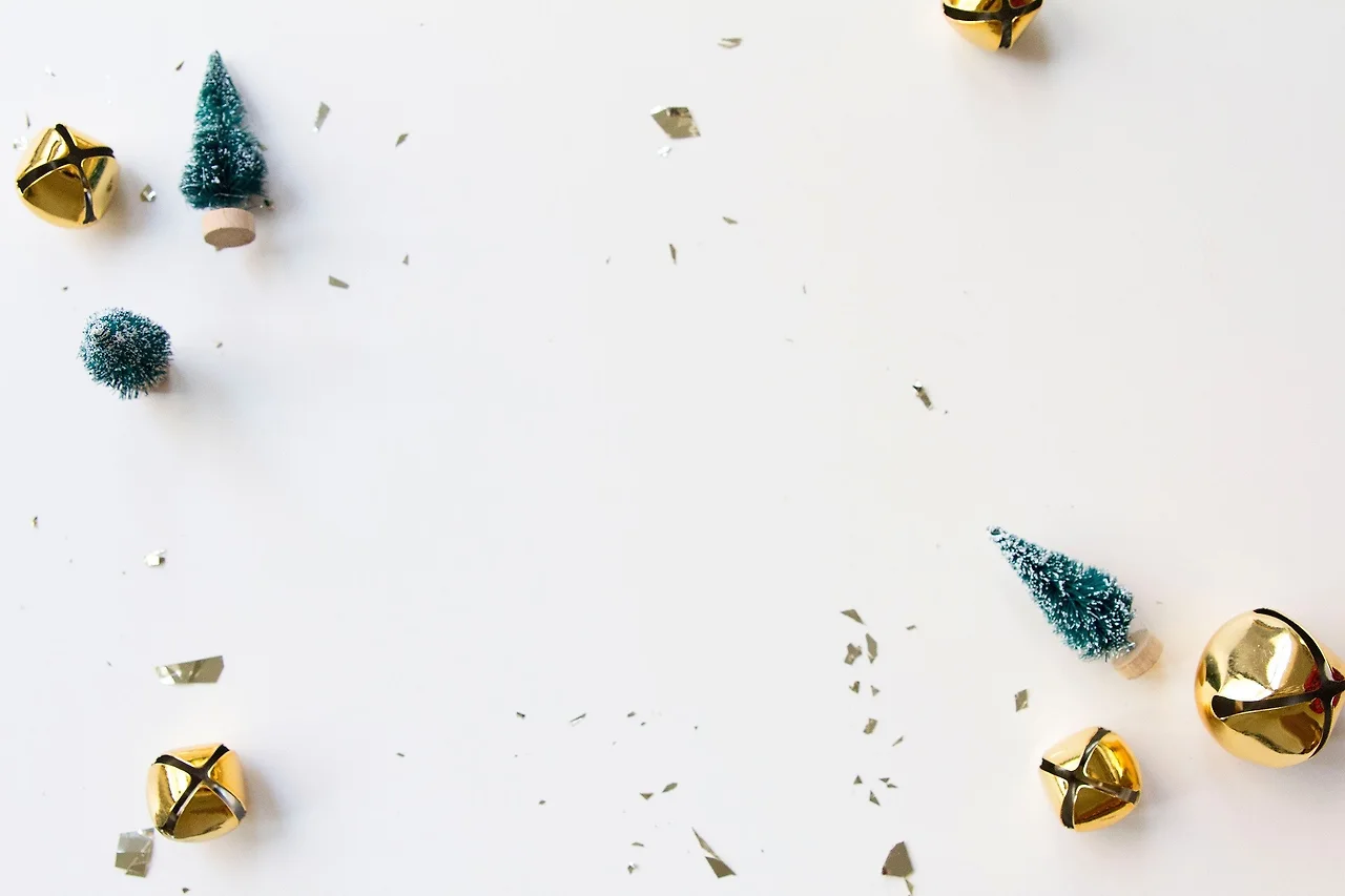 gold-bells-green-toy-trees-white-christmas-background.jpg?fitcropamp;q50amp;w320amp;h213amp;autoformat