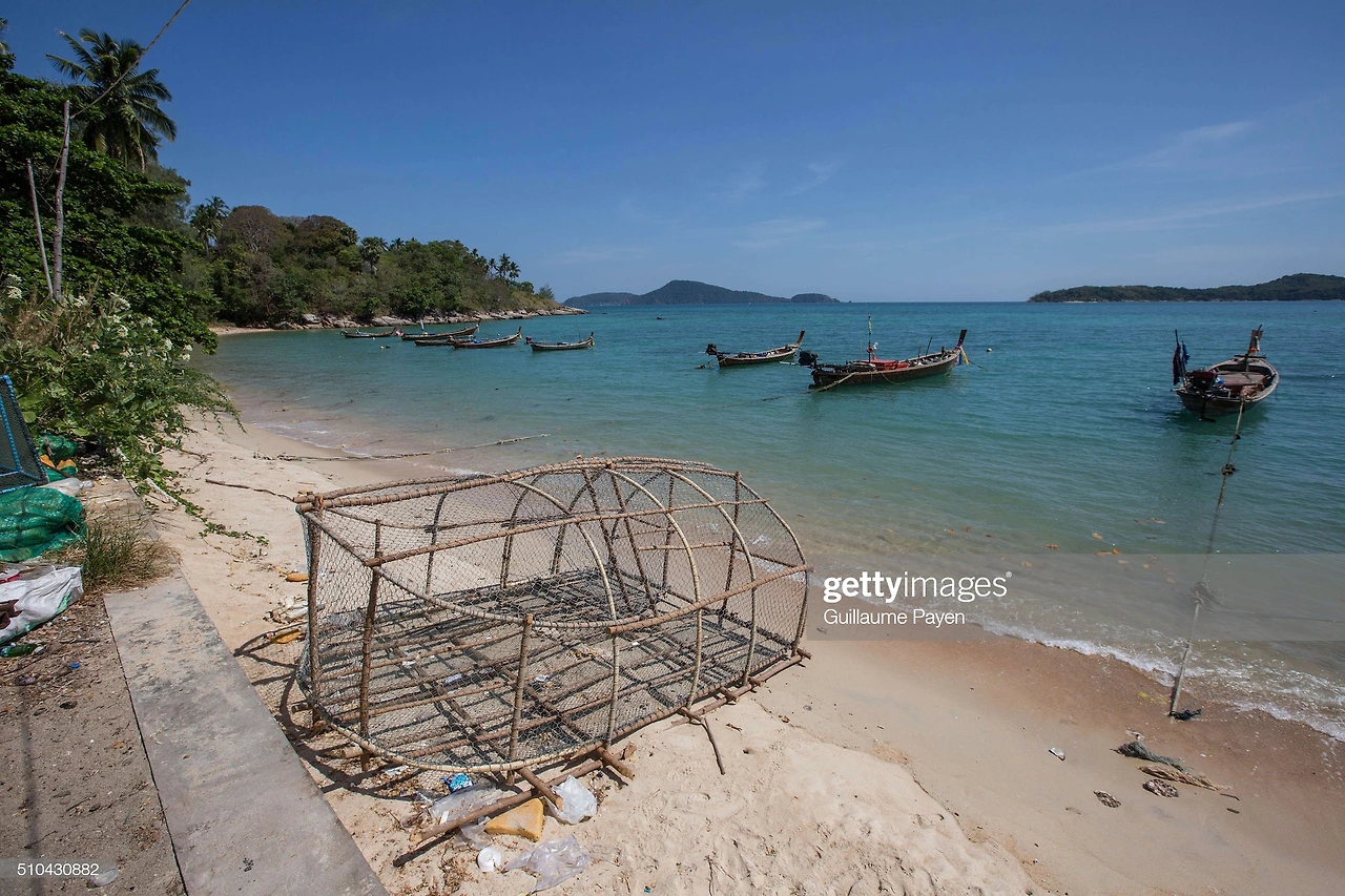 sea-gypsies-fishing-equipment-along-rawai-beach-a-violent-attack-on-picture-id510430882?s=2048x2048