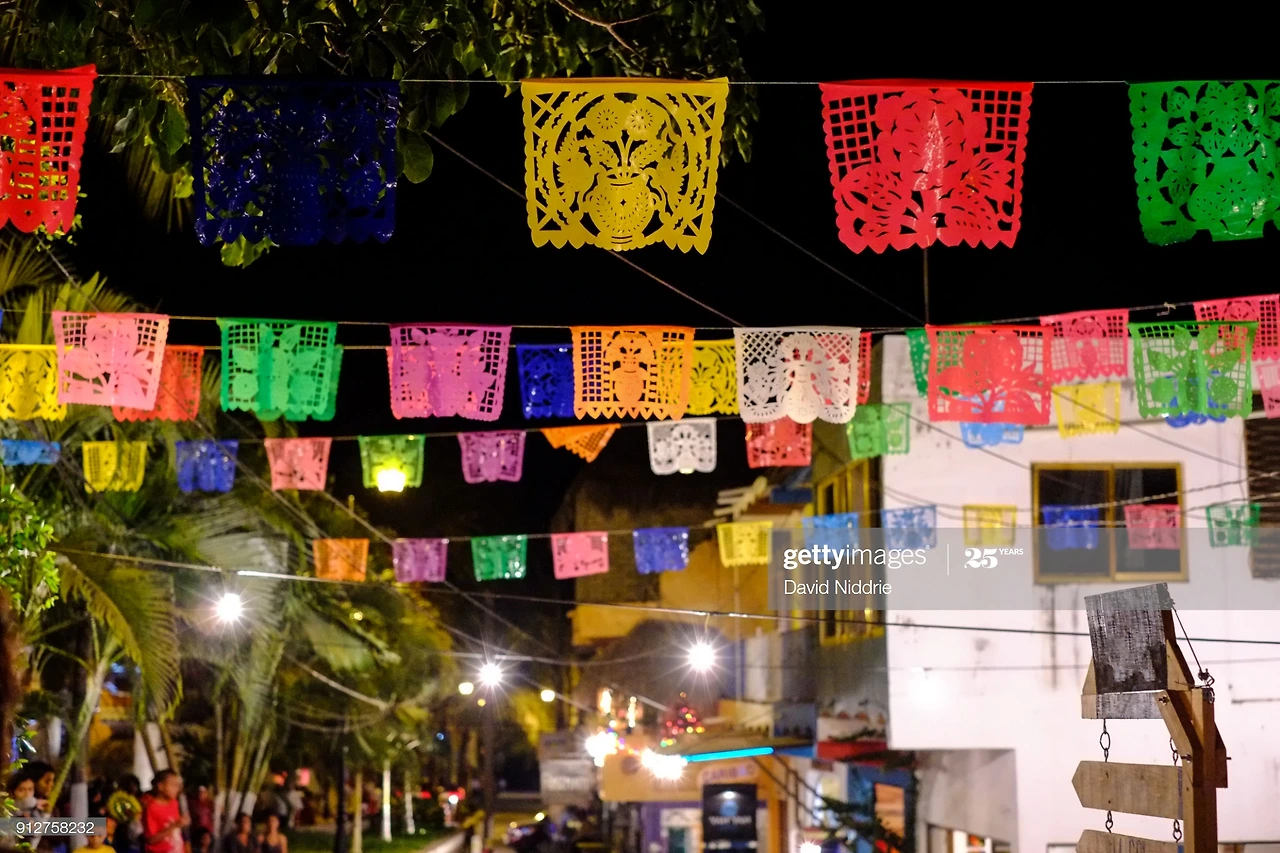 flags-fly-above-the-main-square-in-sayulita-mexico-during-the-our-of-picture-id912758232?s=2048x2048