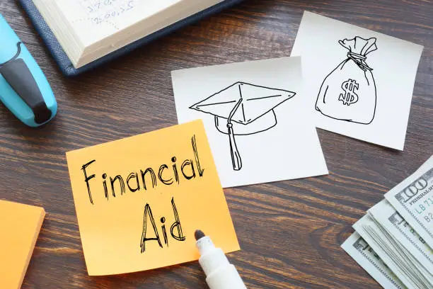 financial-aid-is-shown-on-the-business-photo-using-the-text.jpg?s=612x612&w=0&k=20&c=DY0pTg_hZX22Tw5FLpaNdQrZ3clWelt5AbOb762h6ts=