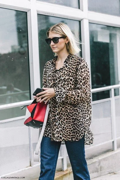 mo6xp7-l-610x610-shirt-fashion%2Bweek%2Bstreet%2Bstyle-fashion%2Bweek-streetstyle-tumblr-animal%2Bprint-leopard%2Bprint-printed%2Bshirt-jeans-denim-blue%2Bjeans-bag-red%2Bbag-loewe%2Bbag-sunglasses-black%2Bsunglasses.jpg?type=w1200